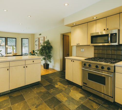 Texas Maids of Frisco team cleaning modern living room