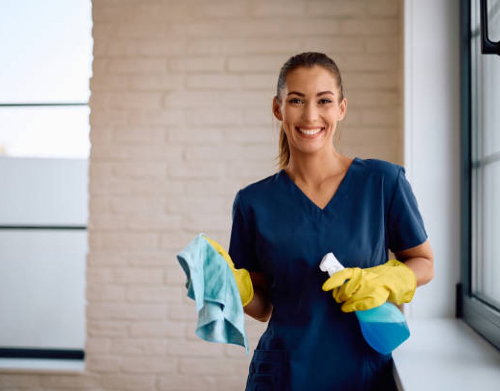 Cleaner refreshing a busy Queen Creek family room before weekend visitors arrive