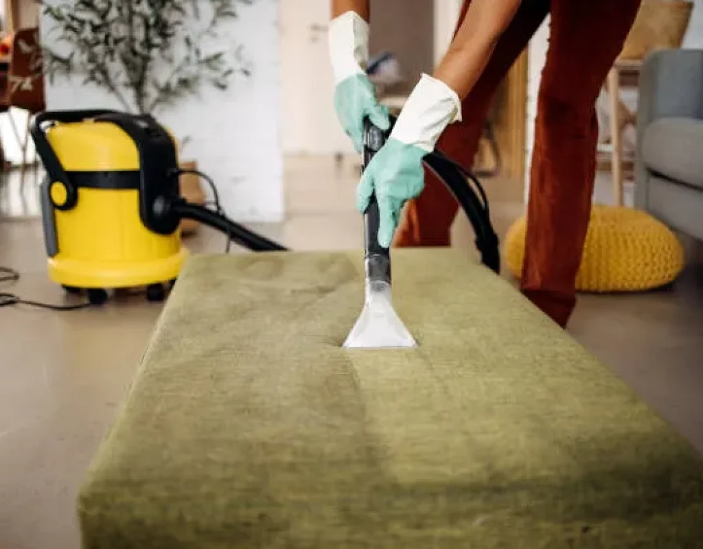 Cleaner maintaining frequently used kitchen and bathroom areas during recurring cleaning in Queen Creek, AZ.